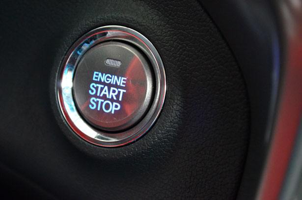 a car with an engine start button