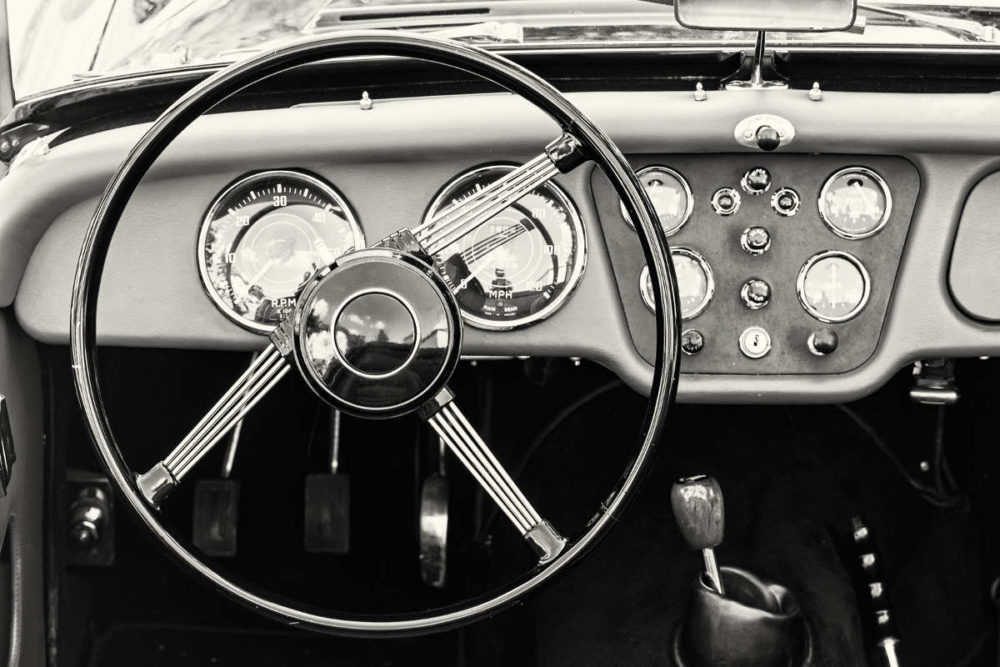 steering wheel and dashboard of an old car